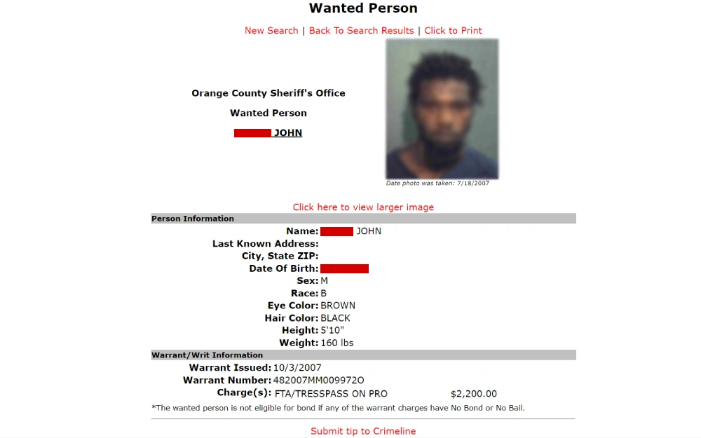 A screenshot of a law enforcement agency's webpage detailing a wanted individual, including a photograph, physical characteristics, and information on an issued warrant with charges and bail amount.